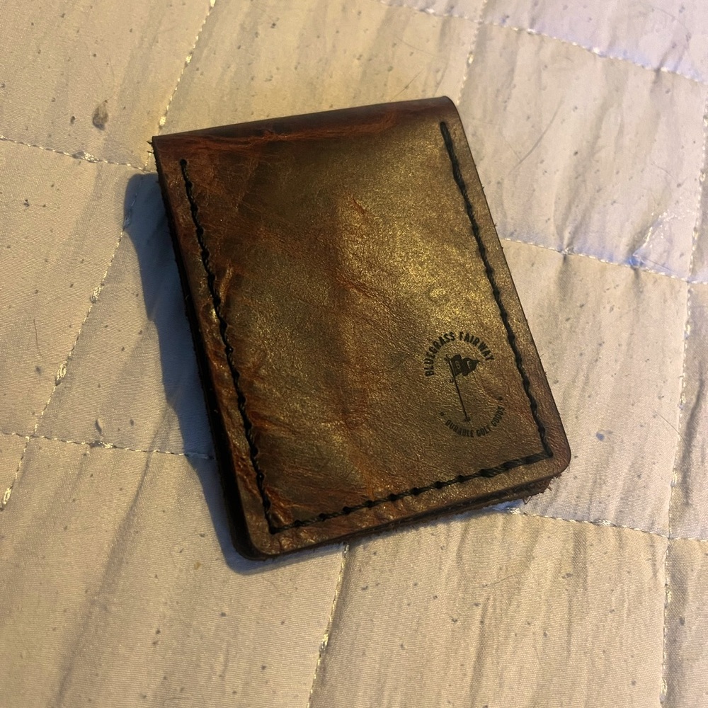Hand stitched bi-fold wallet.